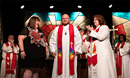 Rev. Michael Vollmer was one of eight people ordained as Elder in the Michigan Conference this year. During the ordination service at the 2023 Michigan Annual Conference, Michael was joined by his wife, Sarah, who also serves as the Annual Conference Registrar for the Michigan Conference (left), and Rev. Suzie Hierholzer, Associate Pastor of Discipleship at Birmingham: First UMC (right). Suzie is a close friend of the Vollmers and has been a mentor for Michael. She and her family are a big part of why they came to Michigan following seminary at Garrett-Evangelical Theological Seminary in Evanston, IL. ~ MIphoto/John Woodring