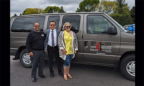 Angel (right) and Lourdes (left) Franco stand beside Rev. Dr. Woojae Im (center), their district superintendent. Im was their connection to the Korean church that donated funds for the van.
