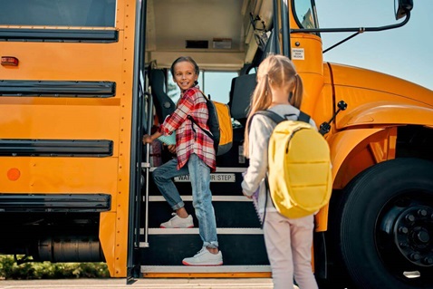 Children boarding a school bus Children boarding a school bus
