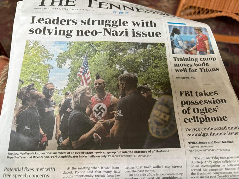 The front page of The Tennessean, showing Rev. Neelley Hicks confronting a hate group