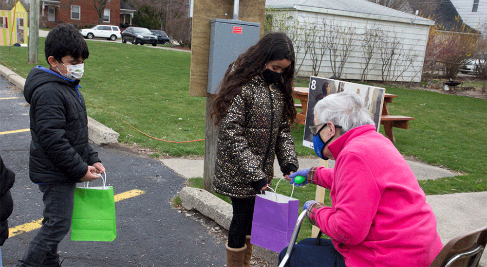 Dearborn: First UMC adopted a family from Jordan as part of their new Response Team ministry, partially funded by a Mustard Seed Migration Grant. The congregation makes sure the family is included in all events and activities. Here, Ahmad and Fatima attend an outdoor Easter StoryWalk and egg hunt. ~ photo courtesy Kristin Karoub