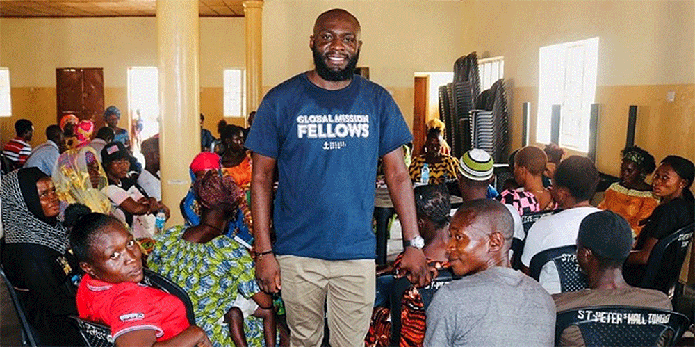 Sam Yav (standing) meets with a group that seeks to understand how climate change impacts their lives and what they can do about it. (Photo: Courtesy of Sam Yav)