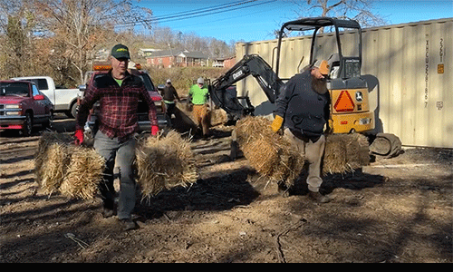 Volunteers delivering hay to victims of Helene as temporary installation for their mobile homes. Video Screengrab.