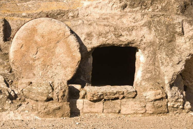 A stone is rolled away from an empty tomb