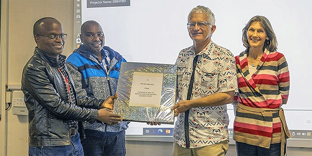 Larry and Jane Kies are recognized during a farewell ceremony held at Africa University in June 2024 as the couple retired from their Global Ministries missionary work after serving in Zimbabwe for three decades. Photo courtesy of Africa University Public Affairs Office.