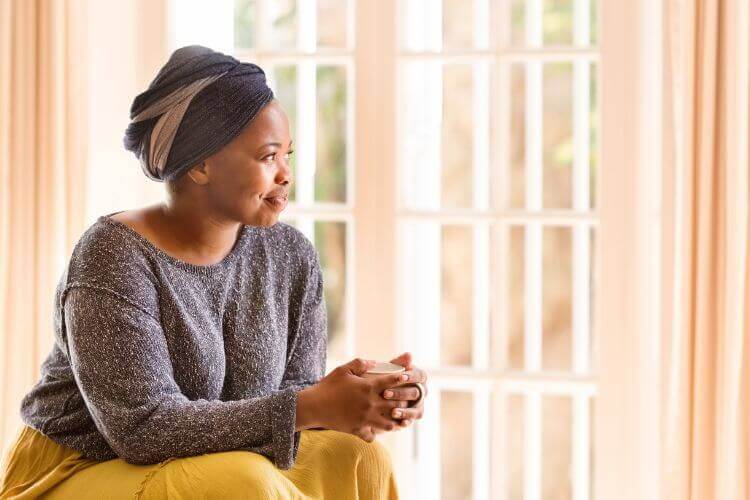 Woman contemplates in silence