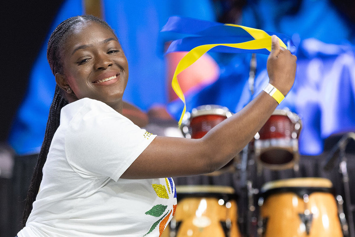 Dancer Briana Hanson joyfully helps introduce a report from United Women in Faith during the 2024 United Methodist General Conference in Charlotte, N.C. After a season of church disaffiliations, United Methodists are moving forward with a new vision, declaring members should “love boldly, serve joyfully and lead courageously.” The Arkansas and Oklahoma conferences have created ad campaigns to support that work and showcase the denomination’s resiliency and values. File photo by Mike DuBose, UM News.