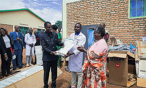 In the center, Niyoyankunze Philemon, head of the health center, and Bishop Emmanuel Sinzohagera (left) receive medical equipment from Dr. Lyduine Baradahana (left), Burundi health minister. This donation is part of a shared commitment to improving the quality of care provided in Gahambwe. Photo by Jérôme Ndayisenga, UM News.