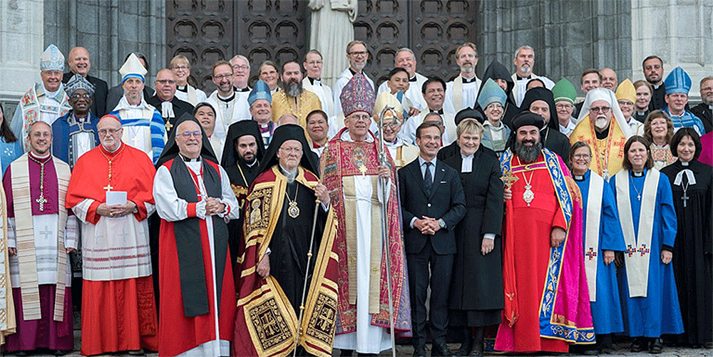 Church leaders from around the globe accompanied by Swedish Prime Minister Ulf Kristersson and his wife Rev. Birgitta Ed, pose for a group photo following an ecumenical prayer service in Uppsala Cathedral.  Photo:  Albin Hillert/WCC 