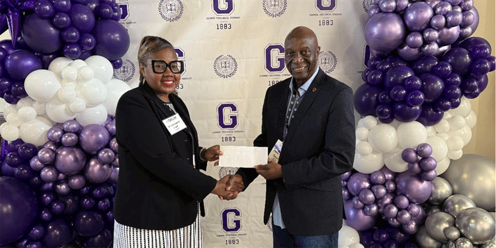 Gammon President Dr. Candace Lewis shakes hands with James H. Salley, President & Chief Executive Officer of Africa University, Inc. and Associate Vice Chancellor for Institutional Advancement, Africa University as he presents a check of his generous donation
