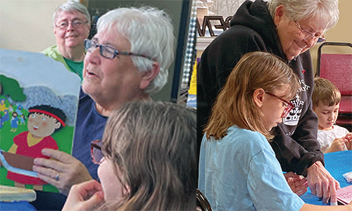 A volunteer helps one of the children at the afterschool program. Courtesy photo.