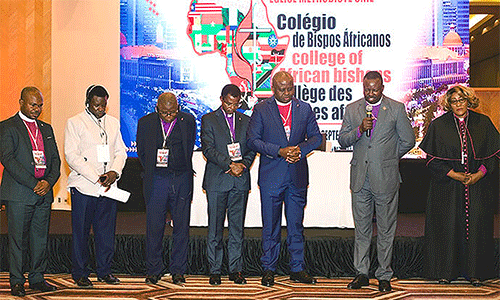 Bishops pray during the Africa Colleges of Bishops meeting in Luanda, Angola. Africa has 14 active bishops, nine of whom were elected to the episcopacy in the past year. Photo by Geraldo Martins, West Angola Conference.