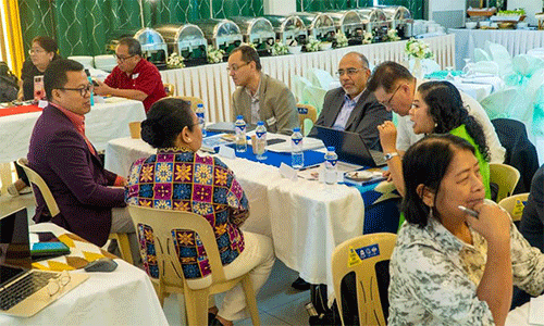 Small-group discussions at the Philppines roundtable meeting with Roland Fernandes (in grey jacket). (Photo: John Leo Sarmiento, JL Visuals)