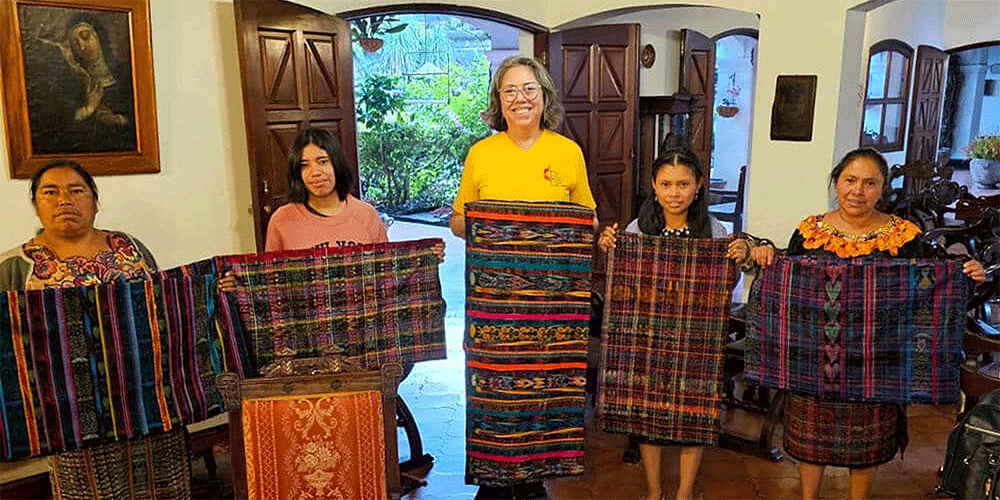 Lulu Ramirez (center) with a Quiche women's cooperative participating in the Guatemalan Methodist Church's microloan program to make traditional cloth for women. (Photo: Courtesy of L. Ramirez)