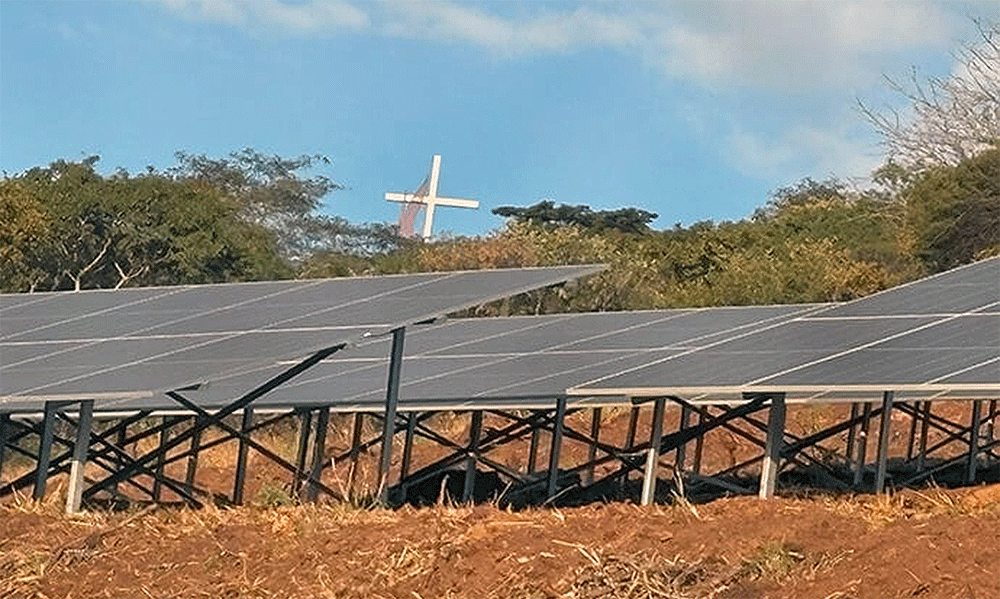 The massive renewable energy plant built below the Africa University Cross and Flame in Mutare, Zimbabwe, includes 576 panels producing enough energy to power 600 households. The solar project is the first and largest in Manicaland province where the school is located. Photo by Eveline Chikwanah, UM News.