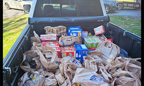 Loaded with canned food, the Rev. Terry Goodman's truck arrives with aid for the United Methodist food pantry in Bishop, Virginia.