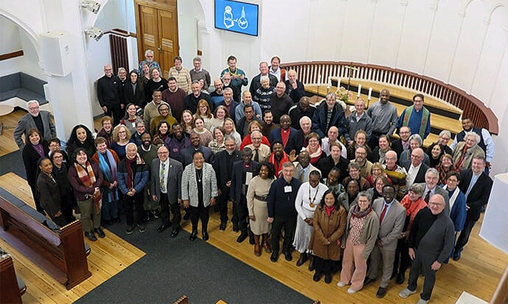All the United Methodist leaders meeting in Denmark stand for a group photo after worship at Jerusalem United Methodist Church in downtown Copenhagen. Photo by Heather Hahn, UM News.