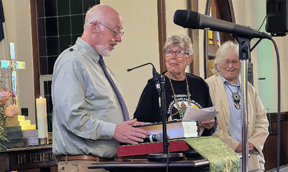 The Rev. David Eckert (left), pastor of Marshallton United Methodist Church, thanks Cynthia Mosley and Barbara Revere of the Greater New Jersey and Eastern Pennsylvania committees on Native American Ministry, respectively, for helping Marshallton develop a land acknowledgement statement that Eckert read to the congregation during its Native American Sunday celebration on Oct. 12. Photo by Sandy Haftl.