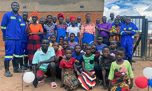 Bishop Gift K. Machinga stands with Mikundi Dairy Farm staff and members of the surrounding community after the farm’s dedication ceremony in November. The farm is seen as a highlight of the Malawi Provisional Annual Conference, which is rebounding after years of legal turmoil. Photo by Francis Nkhoma, UM News.