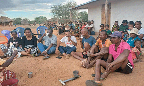 United Methodist evangelists share a drink in Ankilimidega, Madagascar, one of several locations they visited in the southern part of the island nation. The team conducted open-air campaigns and house-to-house outreach in communities where there had never been a church and Christianity was new to many. Photo by Tinasoa Tsimanavaka, UM News.