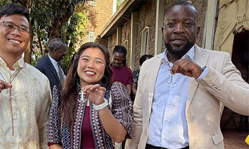 Global Mission Fellow, Earnest Mudzengerere(far right) show his anchor crosses just after they were commissioned as Global Missionaries in Kenya. Photo: Global Mission Fellows, GBGM.
