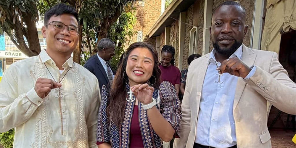 Global Mission Fellow, Earnest Mudzengerere(far right) show his anchor crosses just after they were commissioned as Global Missionaries in Kenya. Photo: Global Mission Fellows, GBGM.